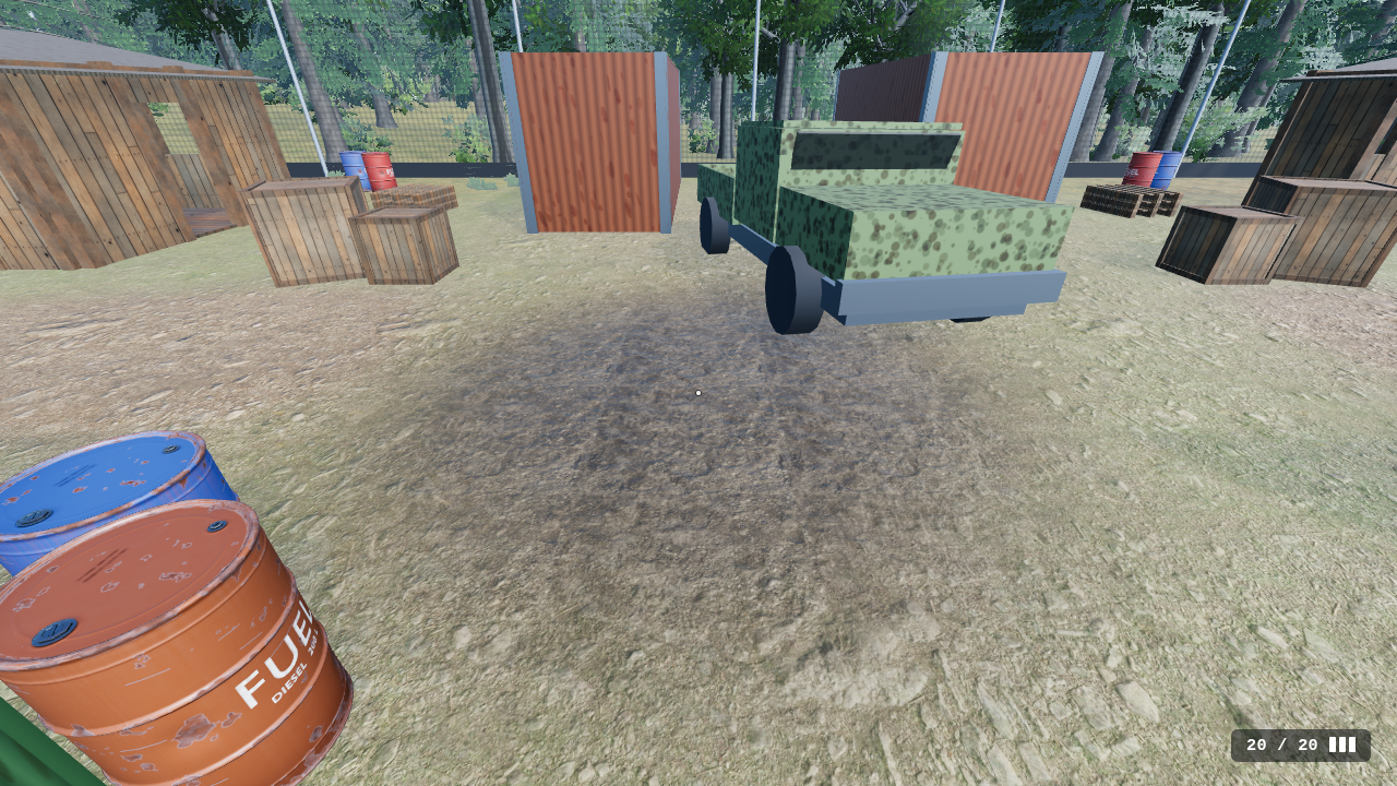 The mud patch at Woodland's outpost: a dark, trampled patch of soil with clods and footprints in the gravel, an old truck, crates, shacks and fuel drums around it.